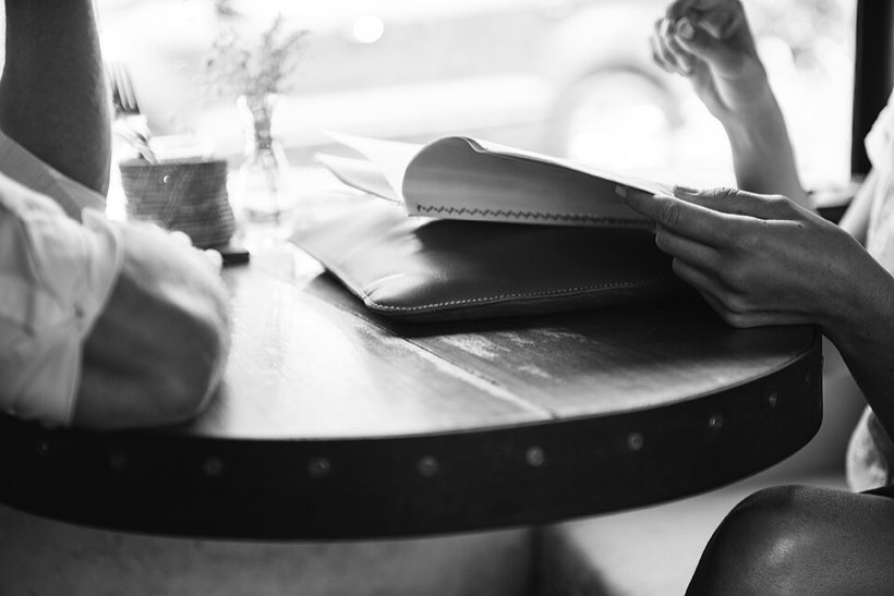 Two people meeting across a table